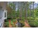 Beautiful backyard landscape with pond, walking path and lush greenery at 769 Hampton Sw Pl, Marietta, GA 30064