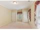 Neutral bedroom featuring two closets and window with floral valance at 769 Hampton Sw Pl, Marietta, GA 30064