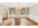 Traditional dining room featuring hardwood floors, decorative windows, and an elegant chandelier at 769 Hampton Sw Pl, Marietta, GA 30064