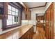 Hallway featuring rich wood trim, cabinets and hardwood floors at 769 Hampton Sw Pl, Marietta, GA 30064