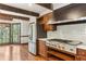 Gourmet kitchen with stainless steel appliances, wood cabinets, hardwood floors, and beam ceilings at 769 Hampton Sw Pl, Marietta, GA 30064