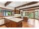 Spacious kitchen with wooden cabinets, white countertops, hardwood floors, and exposed ceiling beams at 769 Hampton Sw Pl, Marietta, GA 30064