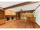 Spacious living room with brick fireplace, wood beams, and built-in shelves at 769 Hampton Sw Pl, Marietta, GA 30064