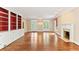 Spacious living room features hardwood floors, a cozy fireplace, and built-in shelving, perfect for entertaining at 769 Hampton Sw Pl, Marietta, GA 30064