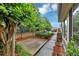 Back patio area enclosed by a black fence, surrounded by lush greenery and trees at 104 Highlands Ridge Se # 1, Smyrna, GA 30082