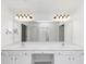 Bright bathroom features a double sink vanity with granite countertop and decorative light fixtures at 104 Highlands Ridge Se # 1, Smyrna, GA 30082