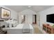 Spacious bedroom with vaulted ceiling, large window, and view into a bathroom with dual sinks at 104 Highlands Ridge Se # 1, Smyrna, GA 30082