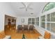 Bright dining room with wood floors, table and chairs, and windows with white shutters overlooking the landscaped yard at 104 Highlands Ridge Se # 1, Smyrna, GA 30082