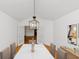 Dining room with hardwood floors, chandelier, and french doors to another room at 104 Highlands Ridge Se # 1, Smyrna, GA 30082