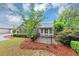 Charming home with stone accents, manicured landscaping, and a cozy front patio enclosed by a black fence at 104 Highlands Ridge Se # 1, Smyrna, GA 30082