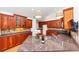 Kitchen with wood floors, wood cabinets, granite countertops, stainless sink and fixtures and under cabinet lighting at 104 Highlands Ridge Se # 1, Smyrna, GA 30082