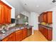 Bright kitchen features wood cabinets, granite countertops, stainless steel appliances, and stylish pendant lights at 104 Highlands Ridge Se # 1, Smyrna, GA 30082
