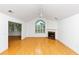 Bright living room featuring vaulted ceilings, hardwood floors, and a fireplace at 104 Highlands Ridge Se # 1, Smyrna, GA 30082