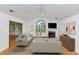 Bright living room featuring vaulted ceilings, a fireplace, and neutral decor at 104 Highlands Ridge Se # 1, Smyrna, GA 30082