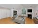 Cozy living room featuring vaulted ceilings, a fireplace, and hardwood floors at 104 Highlands Ridge Se # 1, Smyrna, GA 30082