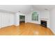 Bright living room featuring vaulted ceilings, hardwood floors, and a fireplace at 104 Highlands Ridge Se # 1, Smyrna, GA 30082