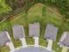 An aerial view shows lovely homes each with a large fenced backyard in a well-manicured neighborhood at 2091 Landsburg Way, Lawrenceville, GA 30043