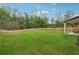 Expansive backyard with lush green grass and privacy fence, perfect for outdoor activities at 2091 Landsburg Way, Lawrenceville, GA 30043