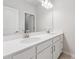 Bright bathroom with double sink vanity, modern lighting, and large mirror at 2091 Landsburg Way, Lawrenceville, GA 30043