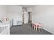 Bright Bedroom with modern changing table, and seating area on soft gray carpet at 2091 Landsburg Way, Lawrenceville, GA 30043