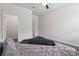 Bedroom featuring a bed with neutral linens, a walk-in closet and two entry doors at 2091 Landsburg Way, Lawrenceville, GA 30043