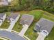 A lovely new construction home features manicured landscaping and a lush green lawn at 2091 Landsburg Way, Lawrenceville, GA 30043