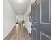 Inviting foyer with hardwood floors, leading to a spacious living area with natural light at 2091 Landsburg Way, Lawrenceville, GA 30043