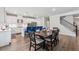 Open floor plan showcases a kitchen with a large island, stainless appliances, and an adjacent dining area at 2091 Landsburg Way, Lawrenceville, GA 30043