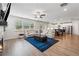 Spacious living room with hardwood floors, fireplace, and view into the bright, modern kitchen at 2091 Landsburg Way, Lawrenceville, GA 30043