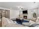 Cozy living room featuring a fireplace with a TV and comfortable furniture, perfect for relaxing at 2091 Landsburg Way, Lawrenceville, GA 30043