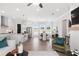 Open floor plan showcases modern kitchen, dining area, and living room with fireplace at 522 Pearl St, Cumming, GA 30040