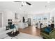 Bright, open-concept living space featuring a modern kitchen with stainless steel appliances and a cozy dining area at 522 Pearl St, Cumming, GA 30040
