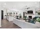 Spacious living room boasts a white brick fireplace, ample natural light, and seamless flow to the kitchen and dining area at 522 Pearl St, Cumming, GA 30040