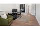 Modern office space with a sleek black desk, comfortable seating, and a stylish rug, perfect for productivity at 522 Pearl St, Cumming, GA 30040