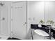 Bathroom features a modern sink with black granite countertop, large mirror and walk-in shower at 800 Peachtree Ne St # 8509, Atlanta, GA 30308