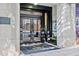 Building entrance with glass doors and visible signage, offering a welcoming facade to the property at 800 Peachtree Ne St # 8509, Atlanta, GA 30308