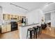 This bright kitchen features stainless appliances, granite counters, wood floors and a breakfast bar at 800 Peachtree Ne St # 8509, Atlanta, GA 30308
