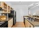 Kitchen features stainless appliances, granite counters, wood floors and ample cabinet space at 800 Peachtree Ne St # 8509, Atlanta, GA 30308