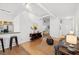 Open floor plan featuring kitchen, living room, modern decor, and wood floors at 800 Peachtree Ne St # 8509, Atlanta, GA 30308