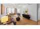 Bright living room with hardwood floors, modern decor, and exposed brick accents offers a stylish living space at 800 Peachtree Ne St # 8509, Atlanta, GA 30308