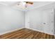The bedroom features a ceiling fan, two doors, and wood-look flooring at 1283 Mercer Ave, East Point, GA 30344