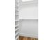 The walk-in closet features built-in shelving and rods for convenient storage at 1283 Mercer Ave, East Point, GA 30344