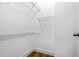 The walk-in closet is a bright white space with built-in wire shelving for easy organization at 1283 Mercer Ave, East Point, GA 30344