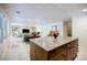 Finished basement with a kitchenette, tiled floors, and a living room area at 1550 Masters Club Dr, Sandy Springs, GA 30350