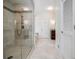 Bathroom featuring a walk-in shower with tile surround, a separate vanity, and ample lighting at 1550 Masters Club Dr, Sandy Springs, GA 30350