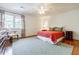 Charming bedroom with hardwood floors, area rug, and natural light at 1550 Masters Club Dr, Sandy Springs, GA 30350