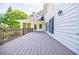 Stunning, long deck offering views of lush greenery and home exterior with neutral tones at 1550 Masters Club Dr, Sandy Springs, GA 30350