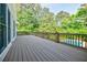 Expansive deck offering a glimpse of the sparkling pool and serene backyard oasis at 1550 Masters Club Dr, Sandy Springs, GA 30350