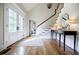 Elegant foyer with hardwood floors, staircase, and double doors offers a grand entrance at 1550 Masters Club Dr, Sandy Springs, GA 30350