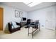Comfortable home office with desk, computer, musical keyboard, and natural light from the skylight at 1550 Masters Club Dr, Sandy Springs, GA 30350